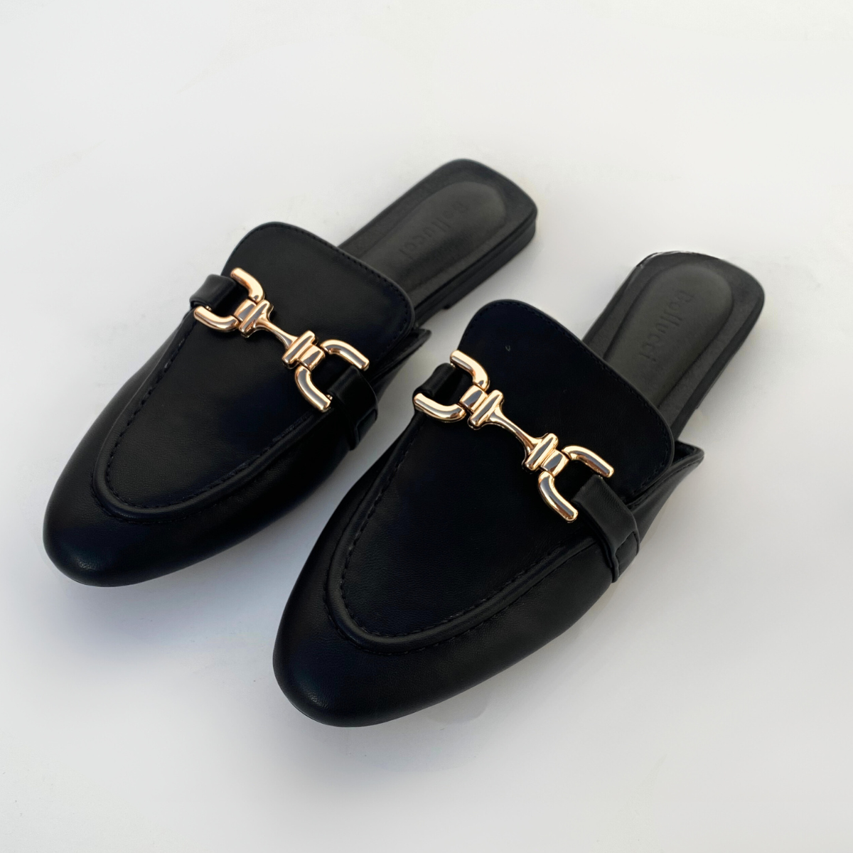 Mules plates en cuir